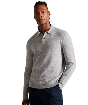 <span style="color: rgb(48, 55, 62); font-family: &quot;IBM Plex Sans&quot;, sans-serif; font-size: 14px; white-space-collapse: preserve;">Unmatched in versatility and enduring in style, The Morar Polo is an essential in any wardrobe, effortlessly combining comfort and sophistication. Whether dressing up for a weekend affair or striving for a laid-back yet polished appearance, this polo offers the perfect solution. Boasting a timeless design with its long sleeves, diamond T stitch and classic collar, this knitted shirt is crafted from a luxurious wool blend and fastened with buttons.</span>