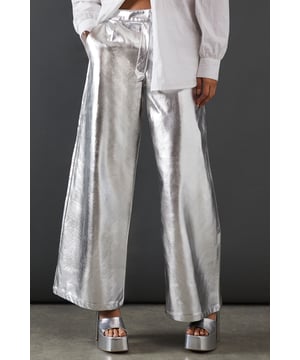 Eye-catching metallic finish for a bold statement
        Wide leg silhouette for a comfortable and trendy fit
        High-waisted design accentuates the waistline
        Front zip and button fastening for a secure fit
        Versatile style suitable for various occasions
    
    Make a dazzling entrance with these striking metallic wide leg jeans from Warehouse. Perfect for those who dare to stand out, these trousers combine comfort with high-impact style. The wide leg cut offers freedom of movement while creating a fashionable silhouette. For a night out on the town, pair these show-stopping trousers with a crisp white shirt, leaving it partially unbuttoned for a relaxed yet chic look. Add some platform sandals to elongate your legs and complete the ensemble with statement earrings. Whether you're hitting the dance floor or enjoying drinks with friends, these jeans will ensure you're the centre of attention. Their versatility also allows for more casual styling - try pairing with a simple black tee and trainers for an effortlessly cool daytime look that transitions seamlessly into evening wear.