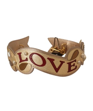 100% authentic Dolce & Gabbana handbag accessory
  Made of gold leather
  Features the iconic Dolce & Gabbana logo
  Made in Italy
  Measurements: 65cm x 7cm
  Perfect for elevating your handbag style