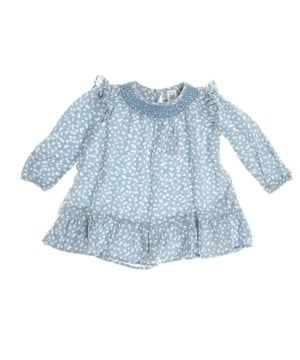 Baby dress with delicate details that enhance her charming style.

 The gathered collar gives it a special touch, and the long sleeves with ruffles on the shoulders add a romantic air.

 The skirt features a soft flare with a ruffle at the hem, adding movement and grace to the design.

 A perfect garment to combine comfort and elegance, ideal for both everyday and special occasions.
 Composition: 100% Viscose
 Care:
- Machine wash max. 30ºC.
 - Use similar colors in the wash.
 - Avoid the use of bleaches.
 - Dry at low temperature.
 - Iron at low temperature.
 - Do not dry clean.
