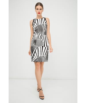 Sleeveless dress in woven stretch print gabardine fabric. Slightly racer shoulders. Black contrast trim around the armholes. Fastens with a concealed zip at the back. Small slit at the back. Fitted silhouette. Fully lined in white fabric.Our model has height 178 cm and wearing size 36. Measurements for size 38 (in cm):Bust-42; Body length-95; Waist-41; Shoulder width-27; Hemline-46. Garment is fitted.
