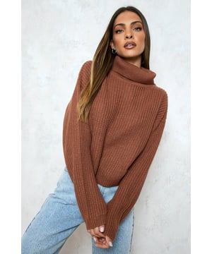 Seeking a pullover jumper that brings super flattering vibes? Look no further than this cute cropped jumper. With the hem cut at or above the waist, this type of short jumper usually comes with long sleeves for maximum style impact and extra warmth. Helping to nip you in at the waist and create an hourglass silhouette, it's a look that will serve attitude over and over again. We wear ours with high waisted denim, slick faux leather trousers and bold animal print skirts for a style that breaks the mould.Style: JumperDesign: PlainFabric: AcrylicLength: CroppedNeckline: Roll NeckSleeve Length: Long Sleeve