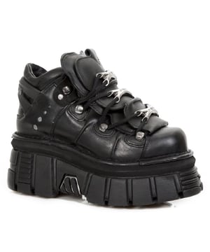 This style of leather ankle boots has become synonymous with the New Rock name and all the quality and style that New Rock is internationally acclaimed for. A distinct metal motif is imbued upon these shoes with additions such as New Rock branded adornments at the laces, metallic detailing inserted in the sole and metallic brand engravings that feature at the heel, all contributing to a stylish gothic theme. For a bold and contemporary edge, the gum rubber heel and sole are raised to a height of 7cm and 5cm respectively, which gives these boots a standout authority that will give you an eye-catching presence. As always New Rock follows through on its reputation for perfection and has excelled in its provision of quality, style, and comfort for this pair of boots.• Heel Height - 7cm• Platform Height - 5cm• Shaft Height - 10cm• Black Laces with metal adornments• Sole Material - Natural Rubber• Outer Material - Cow Hide Leather