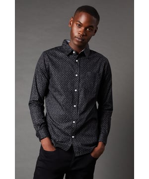 Striking geometric print for a modern, eye-catching look
        Long sleeves with buttoned cuffs for versatile wear
        Classic button-down collar adds a touch of refinement
        Regular fit design ensures comfort and ease of movement
        Versatile dark hue allows for effortless pairing with various outfits
    
    This Maine Geometric Print Long Sleeve Shirt is a stylish addition to any casual wardrobe. The intricate pattern creates visual interest while maintaining a sophisticated appearance. Perfect for family gatherings or relaxed outings, this shirt can be easily dressed up or down. Pair it with dark trousers and trainers for a smart-casual look, or layer it over a plain t-shirt with jeans for a more laid-back ensemble. The buttoned cuffs offer the option to roll up the sleeves for a more relaxed feel. Whether you're heading to a pub lunch or a weekend away, this versatile shirt will keep you looking sharp and feeling comfortable. Its adaptable design makes it an ideal choice for those who appreciate fashion-forward pieces that don't compromise on practicality.