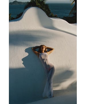 Crafted from barely-there sheer mesh with contour seams that sculpt the silhouette in all the right places, this piece exudes drama. The floor-length dress elevates your beach look taking you from day to night. Style with our range of bikinis or dare to bare some skin and indulge your sensuality.
