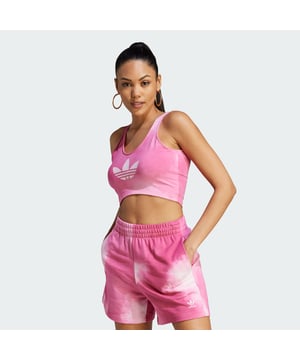 Desert festival, day hike, dance party in your living room — this adidas bra top is ready for it all. Features a faded colour effect inspired by the dreamy, dusty nature of classic Los Angeles adventures. A soft cotton blend and minimalist cut will keep you looking and feeling great wherever the day takes you.adidas partner with Better Cotton to improve cotton farming globally. Better Cotton makes global cotton production better for the people who produce it, better for the environment it grows in, and better for the sector's future.  Better Cotton is sourced via a chain of custody model called mass balance. This means that Better Cotton is not physically traceable to end products, however, Better Cotton Farmers benefit from the demand for Better Cotton in equivalent volumes to those adidas "source." Find out more here: bettercotton.org/learnmore  -