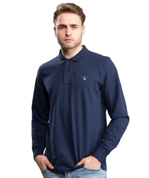 Gant Mens Designer Long Sleeve Polos feature the brands Logo, a Button-Down Collared Neckline. Crafted With 100% Cotton, these Lightweight and breathable Regular Fit Polos are Suitable for Casual or Workwear.