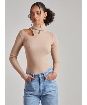Looking for an easy throw-on-and-go option? Look no further. Our Knit Cut Out Turtle Neck Top is the figure flattering style you need this season.