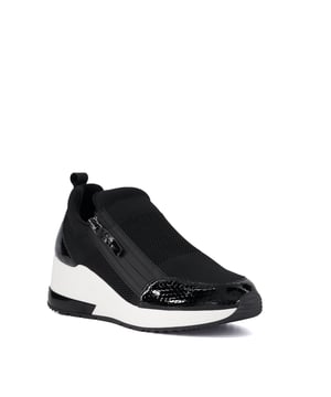 Womens Dune Ellens Heel-Clip Wedge Trainers in black.- Synthetic upper.- Slip on fastening.- Zip detailing down the front.- Pull tab.- Ellens wedge heel.- Synthetic sole.- Ref: 20275066612028