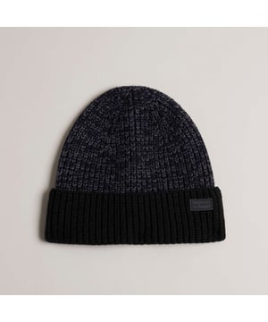 Ted Baker Jannaaa Acrylic Knitted Hat in black.- Wide ribbed trim.- Branded logo patch.- Knitted.- 100% Polyester.- Ref: 271952BLACK