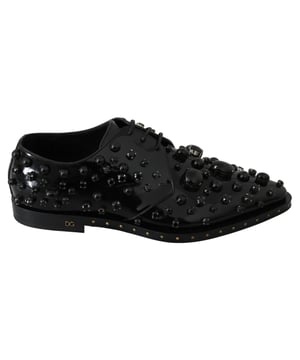Brand new with tags 100% Authentic Dolce & Gabbana Shoes
  Made from black leather with black crystals
  Leather sole for durability
  Logo details for a luxurious touch
  Made in Italy with exceptional craftsmanship
  Exclusive and stylish design
Material: Leather