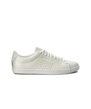 Le Coq Sportif Charline Women's White Trainers – a classic and versatile footwear choice that brings a touch of elegance and simplicity to your casual wardrobe. With their clean white color, timeless design, and comfortable features, these trainers are ready to add a touch of understated charm to your everyday look.

Key Features: 

 Clean White Color:  The Le Coq Sportif Charline Trainers come in a clean white color that offers a timeless and neutral look, making them easy to pair with various outfits.

  Classic Design:  These trainers feature a classic design with minimalistic details, providing an elegant and fashionable touch to your style.

Premium Materials:  Many Charline models are crafted from premium materials, ensuring durability and a quality finish.

 Logo Detailing:  The trainers often feature Le Coq Sportif branding and logo details, showcasing the brand's heritage and craftsmanship.

 Comfortable Fit:  Designed with comfort in mind, these trainers offer a comfortable fit suitable for everyday wear and light activities.

 Lace-Up Closure:  With a lace-up closure, these trainers provide a customizable fit that ensures security during casual wear.

 Cushioned Insole:  Many models incorporate a cushioned insole, offering a soft and comfortable feel underfoot.

 Versatile Styling:  The Charline Trainers can be styled in various ways, from casual streetwear to clean and minimalist outfits.

 Timeless Elegance:  Le Coq Sportif is known for its timeless and classic designs, and the Charline series embodies that sense of elegance and simplicity.