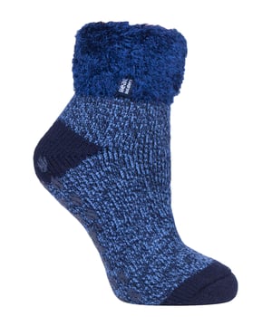 Lounge around the home in these cosy socks. Whether you're looking to stay warm or comfortable indoors, these lounge socks feature a cute and stylish design so you can pair them with any casual outfit! Every Heat Holders® sock, including these lounge socks, are created by UK PATENTED knitting technology. This unique manufacturing process together with Heat Holders® innovative Japanese designed thermal yarn ensures maximum warmth is held close to the skin, keeping your feet warmer for longer. With a strong TOG rating of 2.34, these socks are designed to keep your feet warm as well as retain heat close to the skin. They also prevent your feet from feeling clammy with their soft brushed inner thermal lining. With long pile cushioning, these thermal socks will help keep feet fully comfortable and supported. Heat Holders are made from a specially developed heavy bulk yarn which has extreme thermal-like qualities. These socks would make the perfect gift for any woman who suffers cold feet! Choose from our different colours and styles to suit your woman's fashionable needs! Why not treat yourself to these lovely pair of cosy socks to wear in bed? Featuring a turn over cuff, you can pull up or roll down these socks for a much more comfortable fit! These socks also have a low cut ankle length so you can subtly show off your socks! Stop sliding or slipping on wooden or tiled floors with these non-slip gripped socks. They feature a rubber-like non-slip grip so you can walk around the home comfortably. These socks are available in womens sizes 4-8 UK