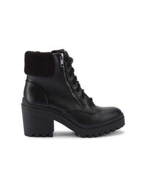 This Tomi boot features a black upper. The front is laced up with a statement zip. The ankle is accented with a black faux Borg trim. Heel height: 6cm.