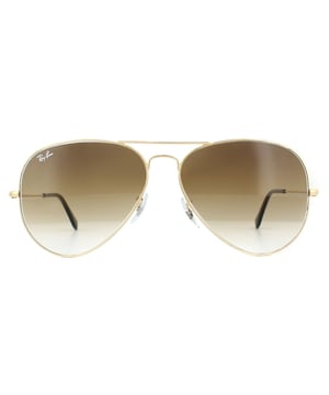 Ray-Ban Sunglasses Aviator 3025 Gold Brown Gradient 001/51 were originally designed in 1936 for US military pilots and have since become one of the most iconic sunglasses models in the world. The timeless design is characterised by the thin metal wire frame, large teardrop shaped lenses and fine metal temples that feature silicone tips and nose pads for a customised and comfortable fit. This classic model is available in various sizes and an array of colourways.