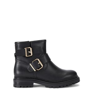 The KG Kurt Geiger Terry is an ankle boot in black. There are two strap across the ankle that are fastened with a gold buckle. The tread is in black.