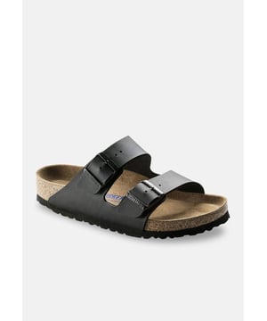 Kleur: Zwart Specificaties: Iconische pantoffel gemaakt met een dermoaffine Birko-Flor bovenwerk, de comfortabele Soft Footbed binnenzool en de klassieke antislip EVA zool. Deze pantoffel sluit met twee verstelbare gespen en is al tientallen jaren een echte klassieker Bovenwerk: synthetisch leer Vetersluiting: gesp Zooltype: EVA antislipzool