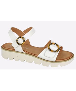 The Cipriata Mimi Halter Back Twin Buckle Wedge Sandal for women is the perfect blend of style and comfort, designed for those looking to elevate their casual or dressy outfits. These sandals feature a sleek wedge heel that provides just the right amount of height while maintaining stability and ease of wear. The halter back design ensures a secure and snug fit, complemented by twin buckle straps that add both functionality and a stylish touch.
Crafted with a synthetic upper is soft to the touch and easy to maintain, offering a sophisticated yet relaxed look. The adjustable buckles allow for a customized fit, making these sandals ideal for all-day wear. The cushioned footbed provides enhanced comfort, while the wedge sole is lightweight and durable, designed to absorb shock and offer excellent grip on various surfaces.

- Synthetic upper

- Cushioned footbed

- Buckle closure

- Cipriata branding