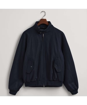 This wool blend Harrington jacket sports a relaxed fit  features a full zip  with two slanted button pockets. The waist is elasticated as well as the cuff sleeves.
