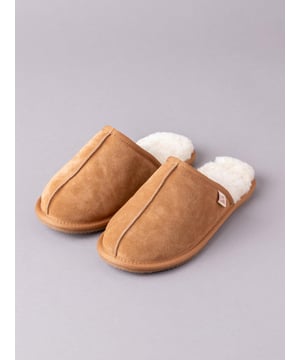 New-in improved quality and design. Keep comfort levels at the top of your agenda with these classic sheepskin sliders. The sheepskin lining is guaranteed to keep your feet toasty warm, whilst the cushioned sole is designed to provide added comfort. The backless style of our men's sheepskin mules enables them to be slipped on and off with ease, and the durable outsole can be subjected to occasional outdoor use (if you really have to go outside!). The natural bounce of the sheepskin may make your slippers feel slightly small at first but the wool will soon mould comfortably to your foot. If the length feels fine, you have the right size. If you can feel your toe is touching the front of the slipper, it is too small, you'll need to size up. We recommend you size up if you are between sizes.