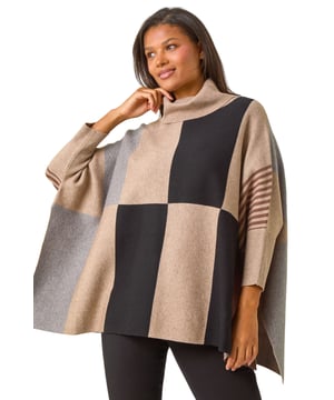 Check Colour Block Knit Poncho from Roman. This style is ONE size.  Stay snug and stylish in our cosy check colour block knit. Crafted from a soft knit fabric, this poncho-shaped jumper features a trendy check contrast pattern. Designed with a flattering roll neckline and long sleeves, this knit is perfect for the Autumn Winter season. Pair with jeggings and ankle boots for a classic fall look that will keep you warm all day long!
