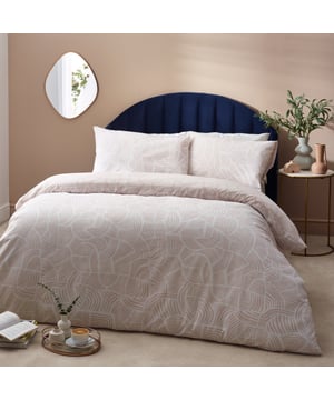 Enjoy a comfortable night’s sleep in the Dunes duvet cover set, inspired by modern, minimalist and abstract art. It features an intricately swirling, abstract line printed design, reminiscent of drifting sand dunes. The reverse reveals an inverted colourway for a more defined look, making it ideal for a midweek refresh if desired. A simple and timeless addition to your bedding collection. This product is certified by OEKO-TEX® showing it has been sustainably made.