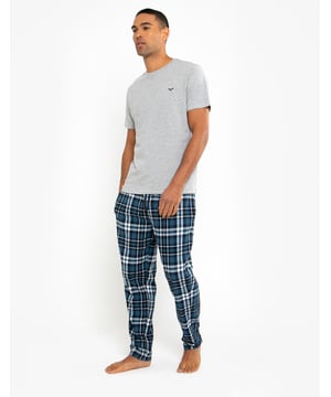 Lounge in comfort with this pyjama set from Threadbare. This set contains a short sleeve, round neck cotton t-shirt with Threadbare embroidery on the chest, and long pants in a flannel check with an elasticated waistband and branded drawcords. This set is super comfortable and perfect for lounging at home or bedtime.
