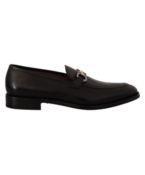 Brand new with tags and dust bag
  100% authentic Salvatore Ferragamo mens shoes
  Model: Lewis
  Color: Black
  Material: 100% Calf Leather
  Formal version of the gentlemens loafer
  Calf leather tumbled and hand buffed for depth of color
  Gancio bit in cool palladium finish
  Open grooves reveal stitching on leather sole
  Made according to Originali construction method
  Made in Italy
Material: Calf Leather