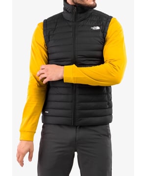 The North Face Stretch Down Vest is a slim fitting insulator that delivers reassuring warmth to your core. The 700 fill Responsible Down Standard goose down is light, comfortable and compressible, while the stretch woven outer allows for unrestricted mobility. Suitable for outdoor use across seasons. It's also finished with a water-repellent treatment, so it shrugs off snow flurries and light showers. It features two zipped hand pockets and internal elasticated cuffs. The gilet Stows in hand pocket. Body: 91% nylon, 9% elastane with non-PFC durable water-repellent (non-PFC DWR) finish. insulation: 90% Down, 10% Waterfowl feathers. 700 fill goose down; certified to the Responsible Down Standard (RDS) by Control Union.