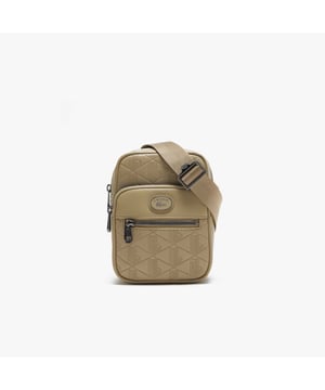 Monogram Print Small Crossover Bag.- Dimensions: L5.1 x L7.2 x D2.7 in.- L13 x H18.5 x D7 cm.- Exterior in Split Calfskin Leather.- Adjustable strap: 75cm - 140cm - 29.5 - 55 in.- 2 zipped outside pockets, 1 mesh inside pocket.- Enamel plaque with crocodile logo. Material: 100% Split Calfskin Leather. Ref: NH4399MRC87.