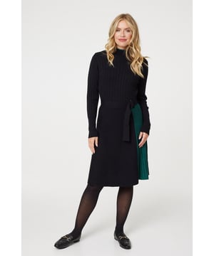 Add a figure flattering knit dress to your closet with this colour block knit dress. With a high round neck, long sleeves, a pleated mid skirt and a belt. Pair with tights and loafers for a chic daytime office outfit or elevate with heels for a smart dinner.