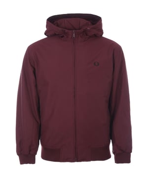 Veste à capuche Fred Perry matelassée Brentham pour homme en rouge  Fred Perry offre un style actualisé et intemporel et la veste à capuche matelassée Brentham ne fait pas exception. Alliant style sportif et élégance, cette veste de sport est fabriquée en sergé de nylon pur avec un rembourrage léger pour plus de chaleur. Capuche à cordon de serrage réglable, fermeture zippée à double sens, poches passepoilées sur le devant, poignets côtelés et ourlet avec double liseré contrastant. Finition avec l'emblématique couronne de laurier Fred Perry brodée sur la poitrine, lui donnant un look immédiatement reconnaissable.-Coupe Regular-Twill de nylon pur-Rembourrage léger-Capuche à cordon de serrage réglable-Fermeture éclair bidirectionnelle-Poches avant passepoilées-Poignets et ourlet côtelés-Détails à double liseré-Logo Fred Perry