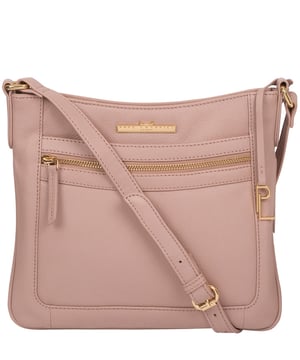 The 'Lewes' cross body bag from Pure Luxuries London, is crafted from naturally milled leather with a beautifully distinct fine-grain feel. A zip-over top secures a gorgeous, 100% natural cotton-lined interior with two slip pockets. On-the-go storage comes in the form of an exterior zipped pocket and two slip pockets, complemented by an adjustable and matching leather shoulder strap. Furnished with gold coloured metal fittings and the elegant Pure Luxuries London charm and logo plate.