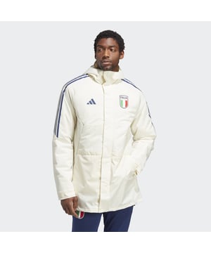 Standing on the sidelines or watching the action from afar. You'll stay warm and dry in this adidas Italy football parka. Its woven, water-repellent shell shrugs off light showers, and the droptail hem and lined hood add extra coverage to keep out the chill. A screenprinted team badge on the chest shows you're a true Azzurri.  - This model is 188 cm and wears a size M. Their chest measures 93 cm and the waist 75 cm. - Regular fit - Full zip with drawcord-adjustable lined hood - 100% recycled polyester plain weave - Lined - PFC-free water-repellent finish - Front zip pockets - Hook-and-loop adjustable cuffs - Split droptail hem with snap closure - Italy screenprinted crest  Shipped by adidas