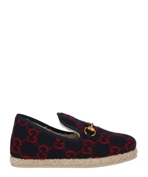 Heel measures at approximately: 0.4"; Slips on; 100% wool; Closed round toe,fur lining; Embellished with signature horsebit and knitted GG pattern;