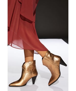 Genuine leather construction for durability and style
        Western-inspired design with pointed toe
        High heel between 7 and 9cm for a confident stride
        Versatile black colour suitable for various outfits
        Ankle-length cut for easy wear and removal
    
    Step into the spotlight with these striking Runway Leather Western Boots from RUNWAY 1.8.1.8. These boots are the epitome of day-to-night versatility, seamlessly transitioning from office chic to evening glamour. The genuine leather upper ensures longevity and a luxurious feel, while the Western-inspired silhouette adds a touch of rugged elegance to any ensemble. Whether paired with tailored trousers for a sophisticated work look or styled with a flowing maxi dress for a night out, these boots are sure to make a statement. The high heel provides a flattering lift, perfect for those seeking to add height and confidence to their stride. Embrace the fusion of contemporary fashion and timeless Western charm with these must-have boots that are destined to become a staple in your wardrobe.