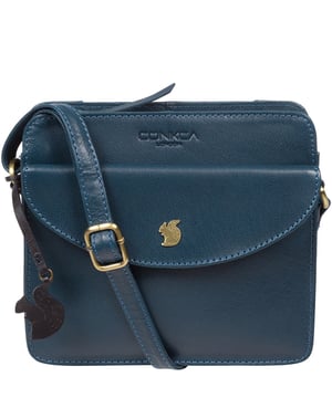 The 'Magda' cross body bag from Conkca London is handcrafted from multi-toned leather for a beautiful finish. A zip-over top opens to reveal a spacious compartment with two slip pockets, lined with natural and untreated 100% cotton. Features a pocket on the front secured with a magnetic press-stud and a slip pocket on the rear, ideal for a smartphone. Comes with an adjustable leather strap with a maximum drop length of 68cm. Adorned with the inimitable Conkca squirrel charm and Conkca logos.