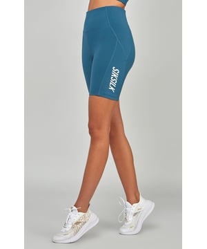 inchTeal Sports Essential Cycling ShortContains 30% recycled polyesterSoft touchHigh riseHigh build print logoSecure back zip pocketFlat seams for comfortMoisture wicking fabricMachine wash82% Polyester  18% Elastane inch
