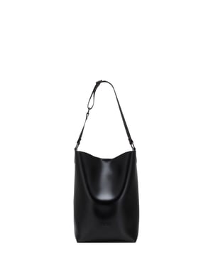 With its unique silhouette and minimalistic design the Leigh Bucket Style Shoulder Bag is bound to become your new staple bag of the season. This wardrobe favourite has ample storage space, giving you the ultimate choice to match any fit. Features: , Unlined smooth PU, Claudia Canova blind debossed logo, Soft and flexible shape, Removable inner pouch with zip fastening, Double front pocket detail, Mag-dot fastening Style Ref: 84314 BLACK