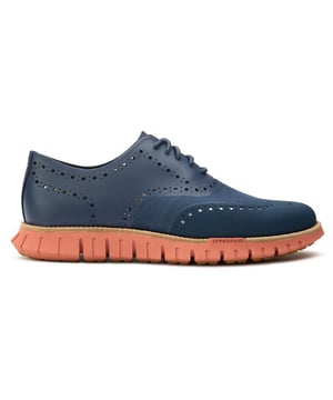 Zapatos Cole Haan Zerogrand Remastered para hombre en color azul, fabricados con piel y suela de goma. Presentan: suela flowerfoam, detalle brogue, marca Cole Haan y goma con diseño de diente de león.