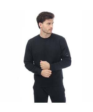 Mens C.P. Company Diagonal Raised Fleece Sweatshirt in navy.- Ribbed crewneck.- Lens detail on the sleeve pocket.- Ribbed hem and cuffs.- Regular fit.- 100% Cotton. - Ref: 17CMSS023A888