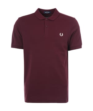 The M6000 is a variation of the classic Fred Perry polo shirt is cut in a regular fit with a slightly slimmer collar and cuffs  than the original M3 style  this timeless shirt has been given a leaner look for a modern silhouette. Crafted from pure BCI cotton pique and in one colour  featuring a two-button placket  a classic rib-knit collar and cuffs. Finished with the signature Fred Perry wreath logo  embroidered on the chest .BCI - By buying BCI cotton products  you're supporting more responsibly grown cotton through the Better Cotton Initiative.-Regular Fit-Pure Cotton Pique-Rib-knit Collar with Two Button Placket-Short Sleeves with Rib-Knit Cuffs-Recycled Sewing Threads-Buttons Made from Recycled Materials-Responsibly-Sourced Laurel Wreath Embroidery-Fred Perry Branding