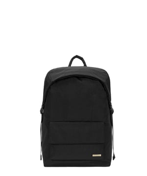 Cut from our signature nylon, the Flapover Nylon Backpack’s adjustable flap over opening provides easy access to your essentials with a secure double clip fastening. Inside there is ample space for a 15” laptop, twinned with external front and rear pockets for additional storage options. Features: , Flap over opening, Internal drawstring opening Front flap over zip pocket, Rear zip pocket, Internal flap over zip pocket SMITH & CANOVA antique brass logo, Branded antique brass zips, Padded grab handle, Adjustable padded backpack straps, Internal 15 inch padded laptop sleeve, Internal zip pocket, 2 Internal mobile phone slip pockets - fits normal and plus size smart phones, 2 Internal pen slip pockets Style Ref: 92680 BLACK