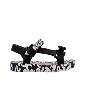Experience unmatched fun and fashion with the Mini Melissa Playtime + Fabula - the sport sandal (papete) you never knew your mini desperately needed! The silhouette and has treaded soles and velcro straps with M logos. The insoles feature a unique, colorful print that is the perfect extra detail for a sunny day.