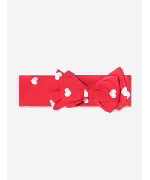 Finish off their look with this pretty red cotton jersey headband by luxury brand, Monnalisa. With a scattering of white hearts this soft and stretchy features a large fixed bow on the front.
