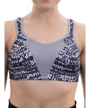 Shock Absorber Multi Sports Bra. Crop design with sports bra support, full back opening and racer back. With adjustable padded straps and powermesh side panels. Product is recommended hand-wash only.