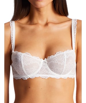 Aubade Danse Des Sens Half Cup Bra. With reinforced back construction, lycra lace trim/strip and a satin bow detail. The product is hand-wash only.