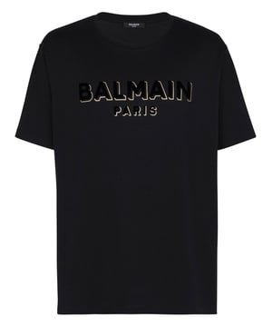 Black crewneck T-shirt from Balmain. Crafted from cotton, this style features short sleeves, an elasticated collar and a black and gold-tone velvet-flocked logo print on the front.