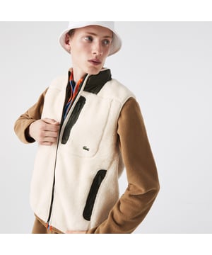Mens Lacoste Sherpa Fleece Vest in cream.- Contrast stand-up collar.- Full zip fastening.- One zippered chest pocket.- Two side pockets.- Warm and soft.- Embroidered crocodile on chest.- Taffeta and mesh lining.- 78% Polyester  22% Acrylic. - Ref: BH3345U9N