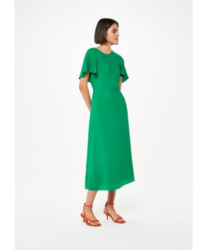 Elevate your occasion wear with the timeless elegance of our Annabelle Dress, featuring cape sleeves and a classic silhouette.